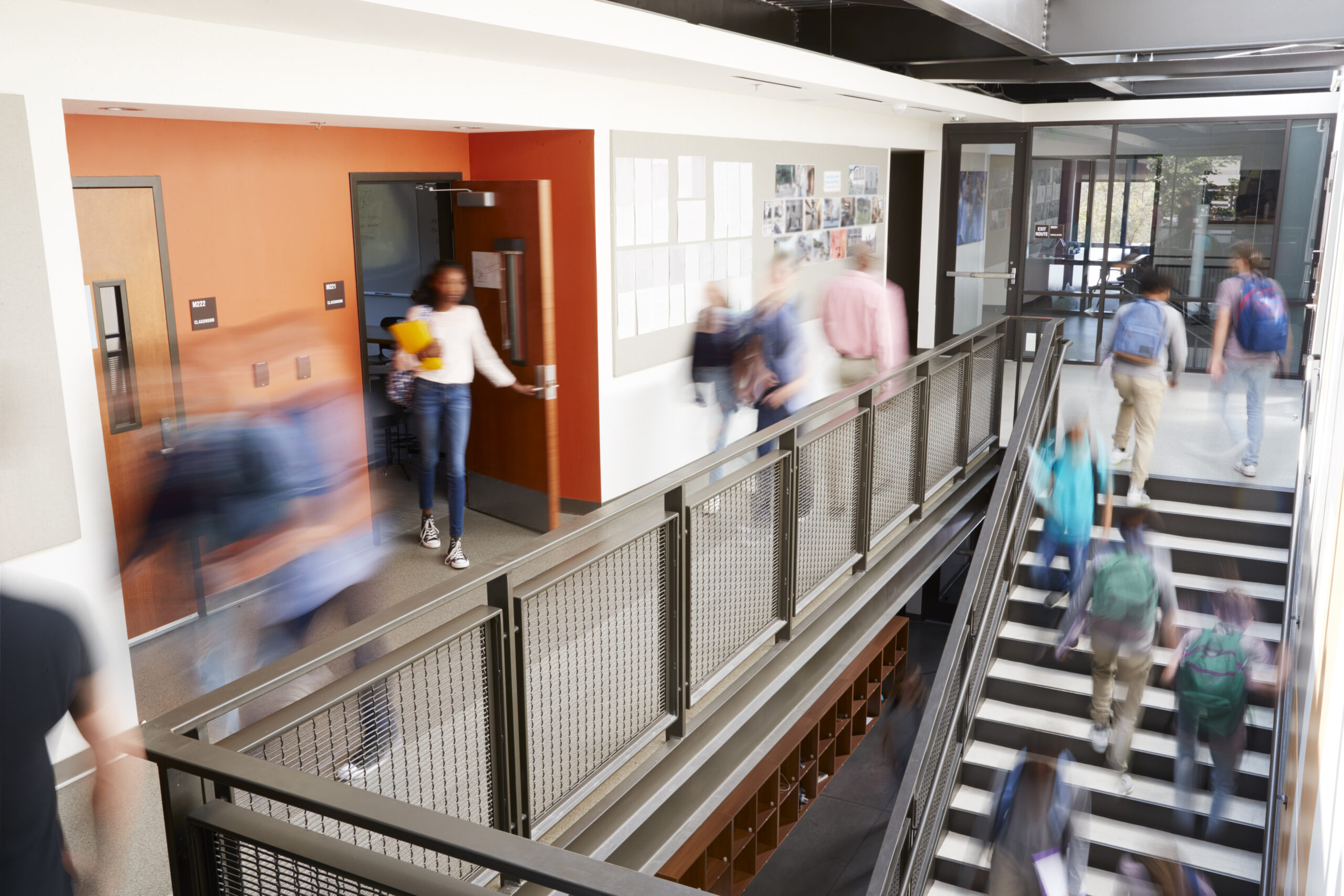 Image of Busy High School Corridor During Recess With Blurred Students And Staff in September
